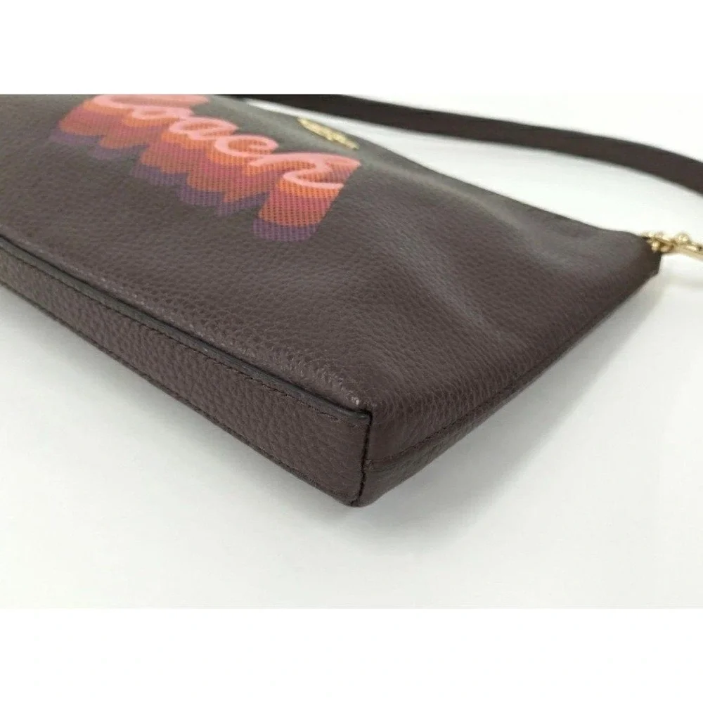 LARGE WRISTLET 25 WITH NEON COACH SCRIPT COACH NWT